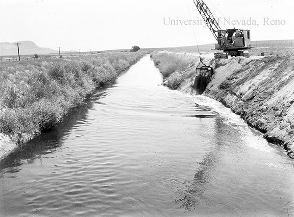 Black and white photograph of a ditch built by the Bureau of Reclamation's Newland Project.