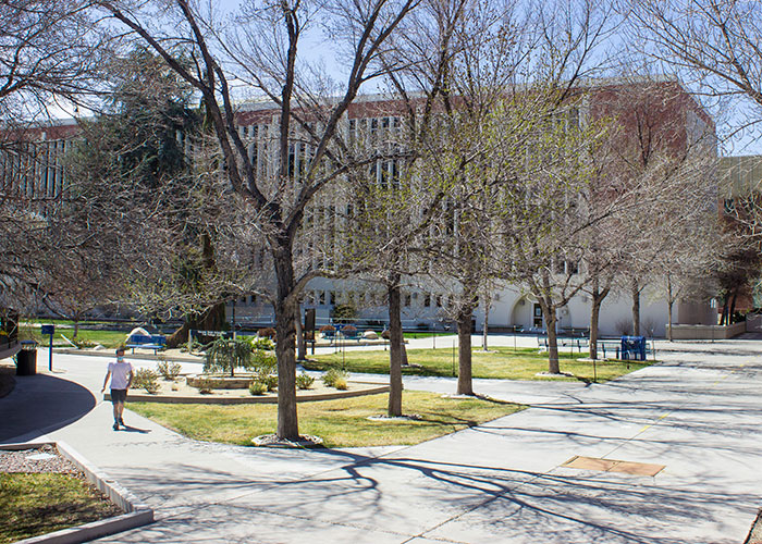 Student walking through the courtyard