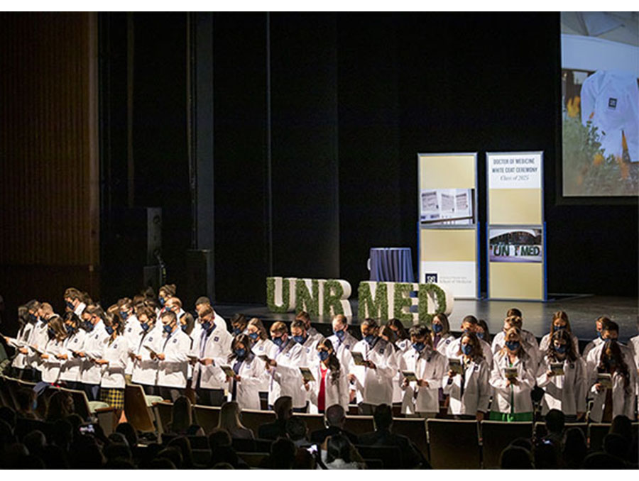 A photo of the UNR Med Class of 2025 reciting the pledge at the White Coat Ceremony.