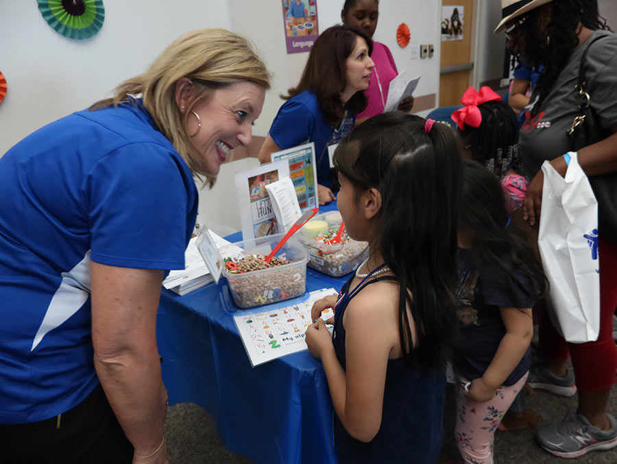 A young girl enjoys a hands-on learning activity at a previous Kickoff to Kindergarten event.