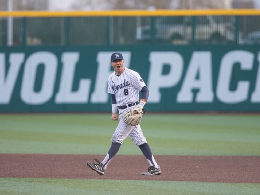 Joshua Zamora on the field during a baseball game looking happy