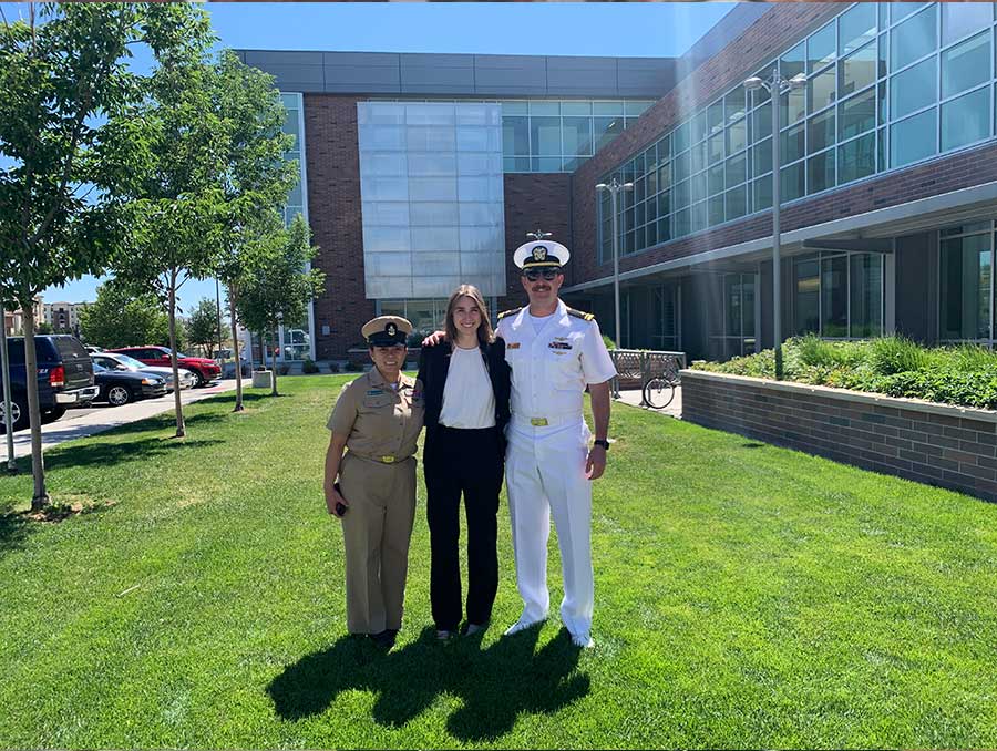 Lindsay stands with fellow U.S. Navy members during her induction ceremony into the U.S. Navy