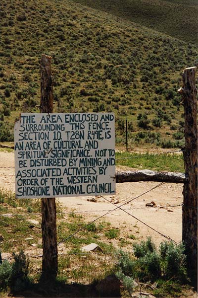 handwritten sign marking area as an area of cultural and spiritual significance, posted on fence