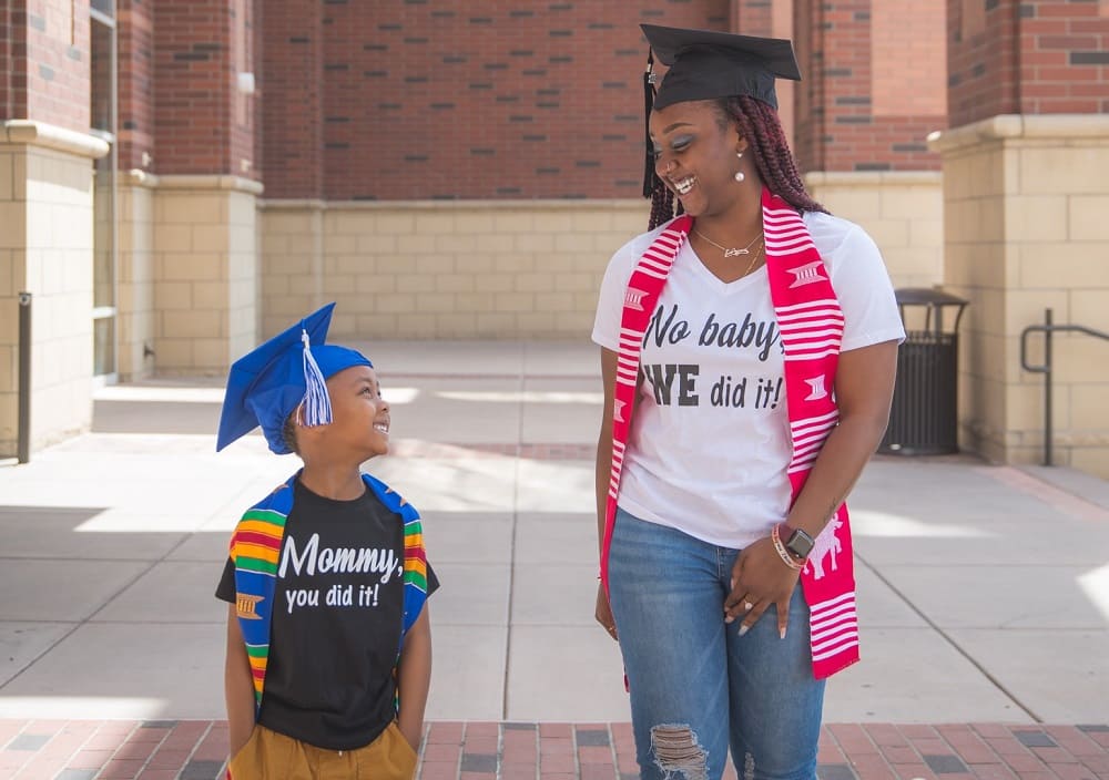 KaPreace Young and her son, both in graduation caps