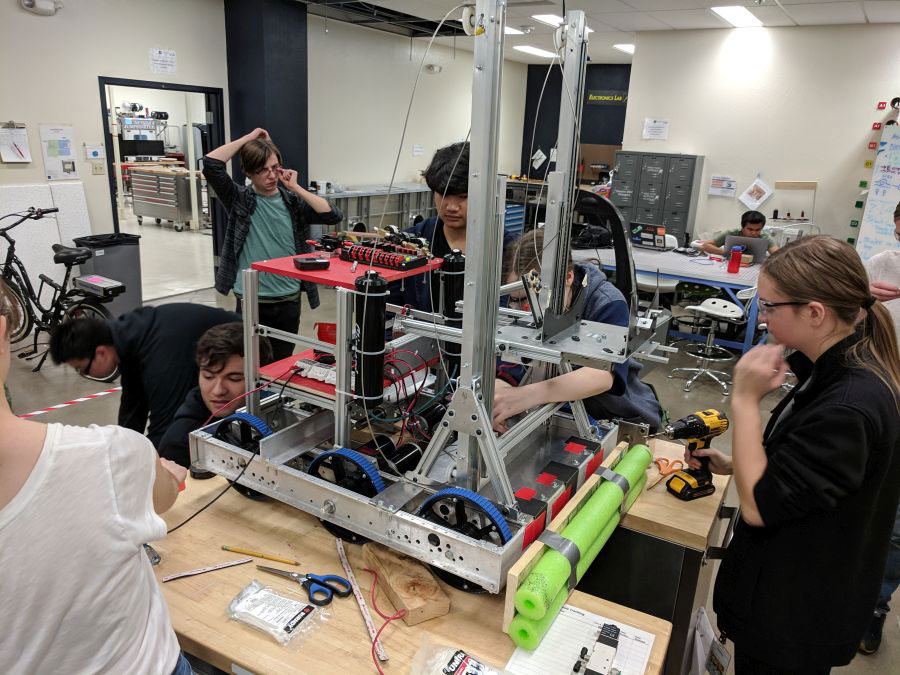 The FYRE Robotics team of students, ages 13-18, builds a robot in the Makerspace of the Innevation Center.