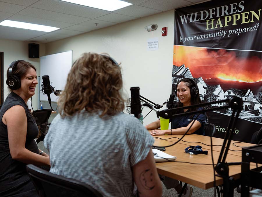 Christina, Megan, and Jamie surrounded by recording equipment. 