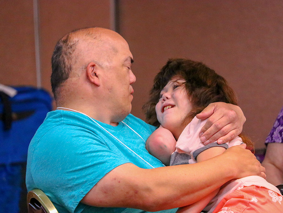 Parent with a happy child that has a disability