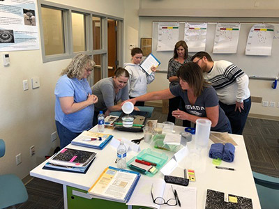 Group of teachers looking over lesson plans