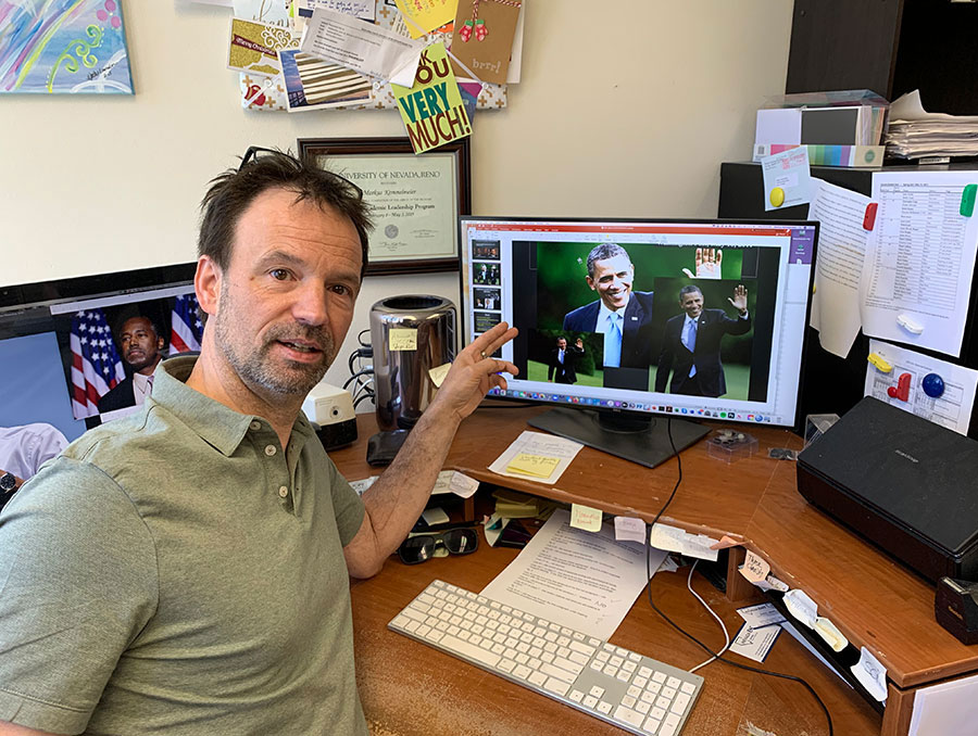 Markus Kemmelmeier points out examples on his computer of image samples used in his research study that address how the same photograph published in multiple newspapers portray skin tone differently.