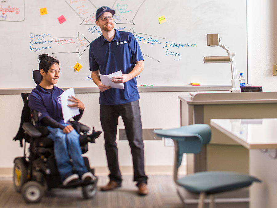 Teacher with student in a wheelchair