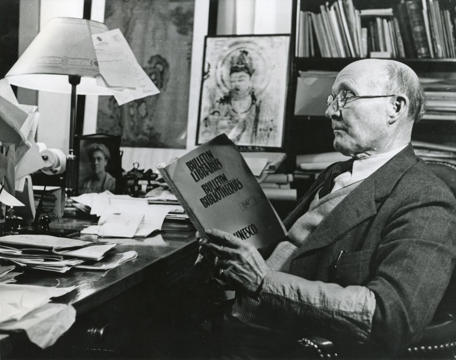 James Church sits at his desk in his campus office.