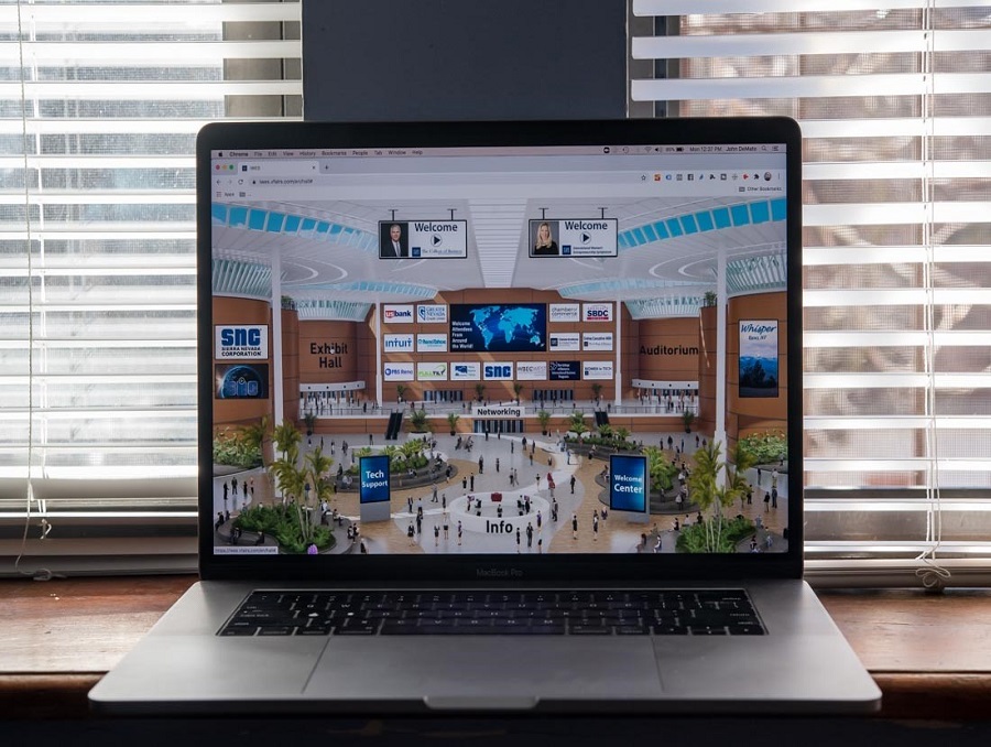 The International Women's Entrepreneurship Symposium's virtual conference platform displayed on a MacBook computer.