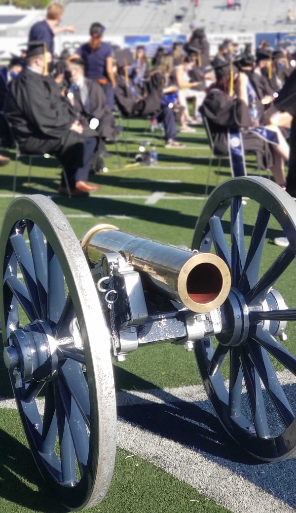 The Fremont Cannon in front of graduates