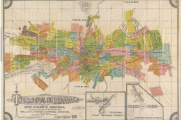 A hand-drawn map from 1912 showing a color-coded view of the many mines and ore types in the Tonopah Mining District