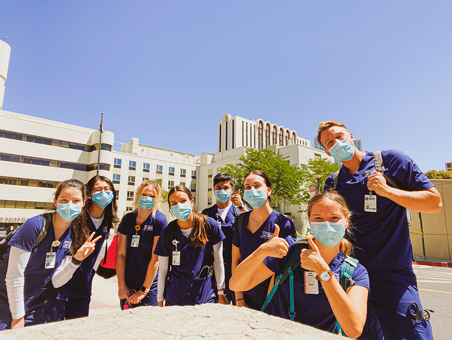 A group of Orvis School of Nursing students in their scrubs standing inside a hospital during clinicals