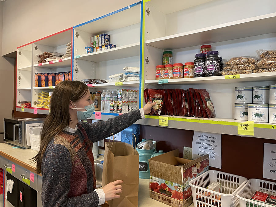 student filling food order 