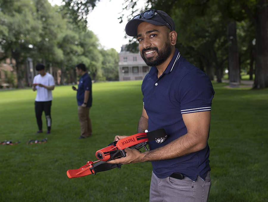 Sanket Lokande on the Quad holding a drone