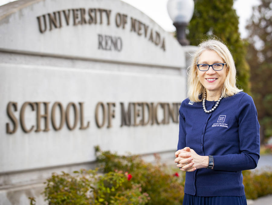 Dr. Piasecki in front of the UNR med Sign