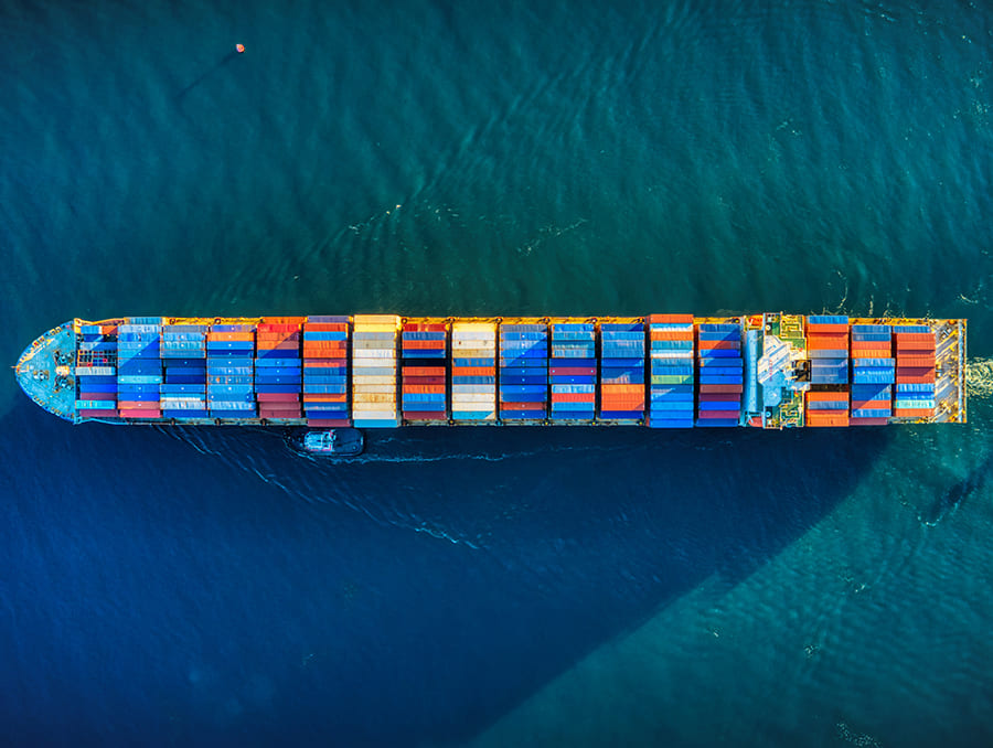 A cargo ship with colorful shipping containers at sea.