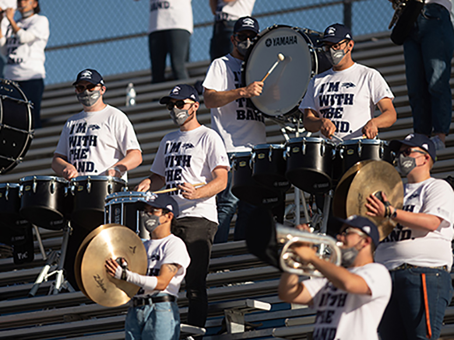 Pep band performing in bleachers