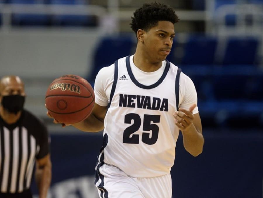 Grant Sherfield with a basketball on the court