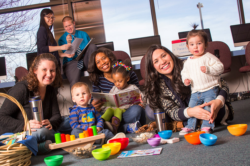 Group of kids and parents in play room