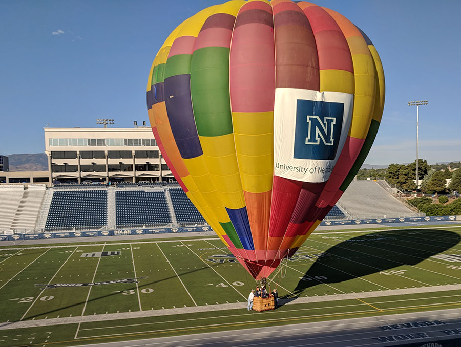 Inflated hot air balloon with Nevada logo on the field in Mackay Stadium