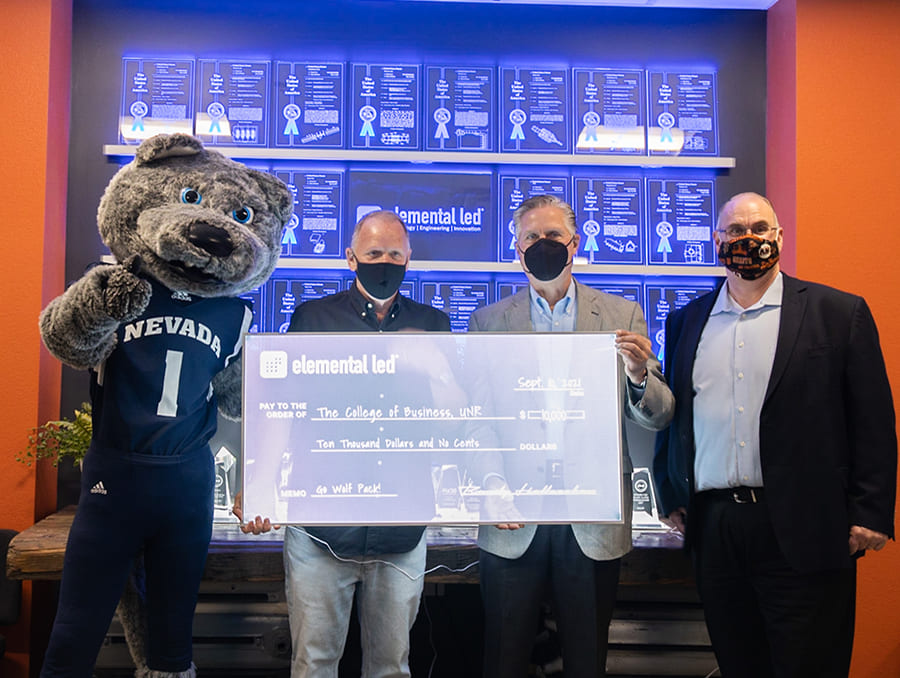From left, Elemental LED’s President Randy Holleschau, College of Business Dean Greg Mosier and Director of Career and Corporate Outreach Jim McClenahan, holding LED check for the College of Business.