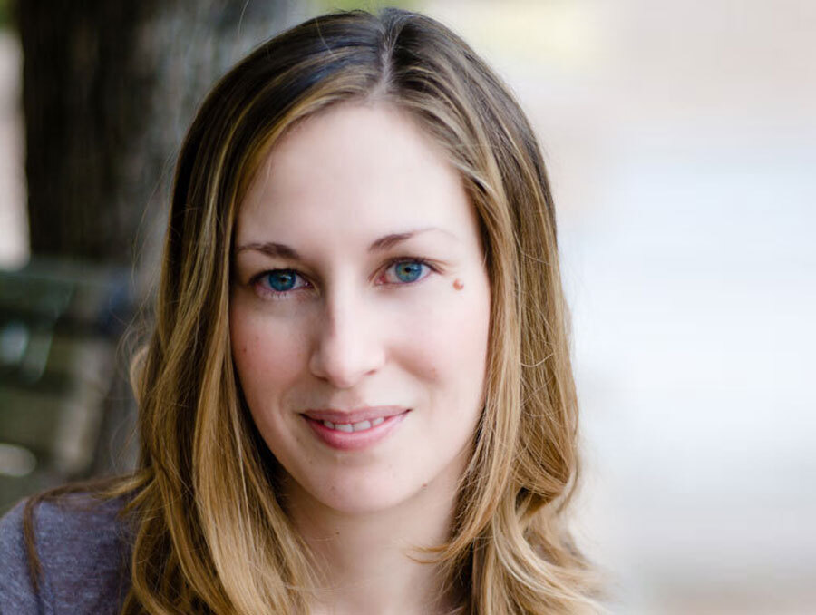 Elizabeth Pringle smiles, wearing a blue shirt.