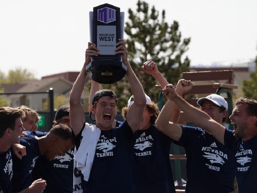 The Mens Tennis team celebrating with their Mountain West Champions trophy