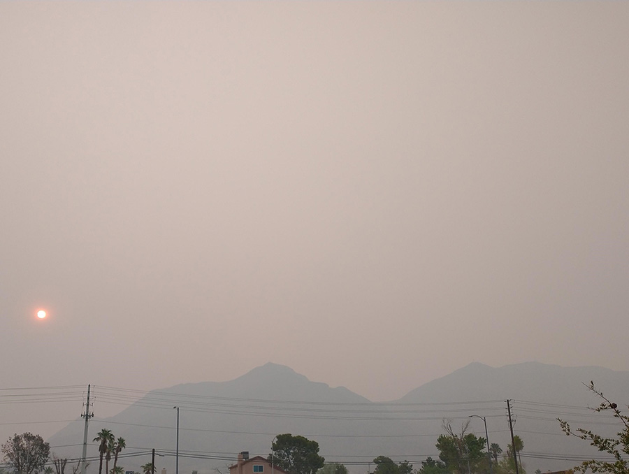 View of a city hazy with smoke.