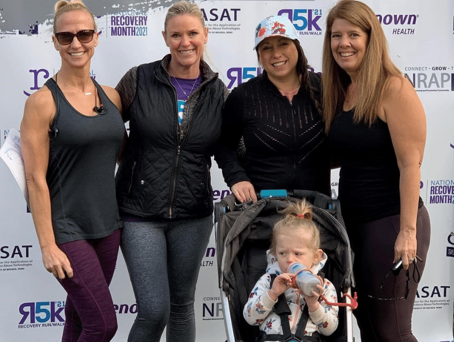 NRAP Project Director Terra Hamblin, standing with 5k racers at the previous 2021 event.