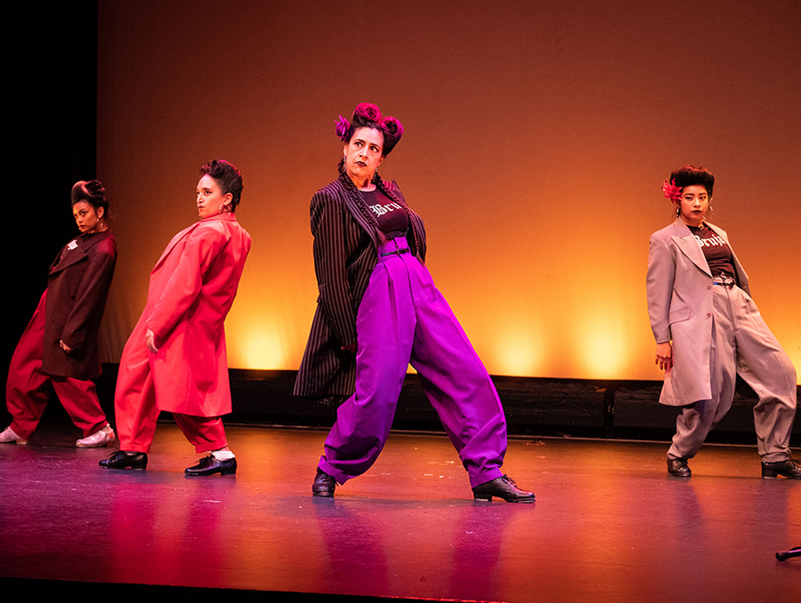 San Francisco-based polyrhythmic dance and music ensemble, La Mezcla, dancing on stage.