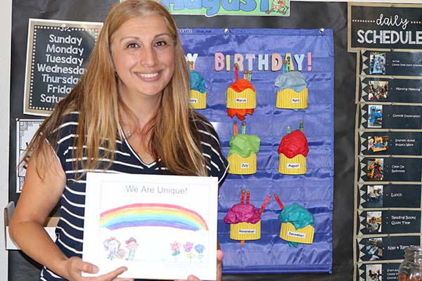 Teacher holding the published book