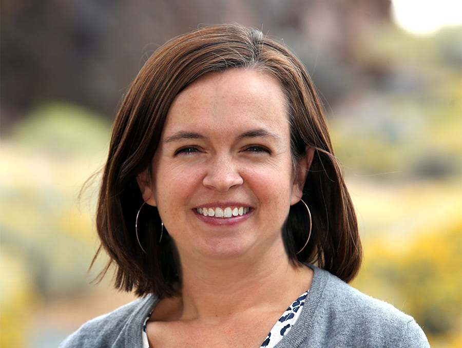 A headshot of Kelsey Fitzgerald smiling to camera.