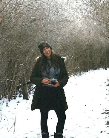 Katelyn smiling outside in a snowy field.