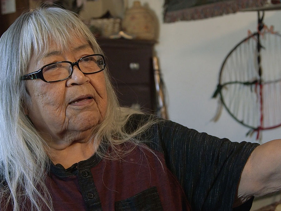 A woman with grey hair being interviewed for the student documentary "From Caribou to KRBU"