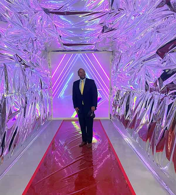 Engineering Dean Erick Jones inside a decorated semi truck.