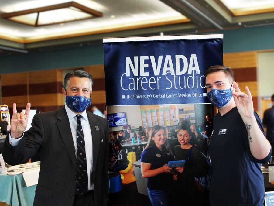 President Brian Sandoval and student attending career fair