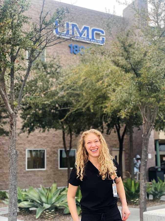 Stone Jamison in black scrubs at UMC.