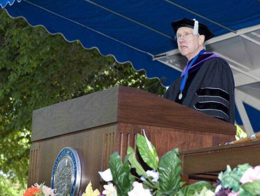 Senator Harry Reid stands on stage and gives a speech at the University of Nevada, Reno Spring Commencement, 2007