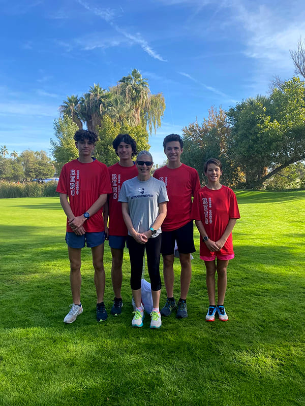 Banducci and pupils in running gear on a sunny day