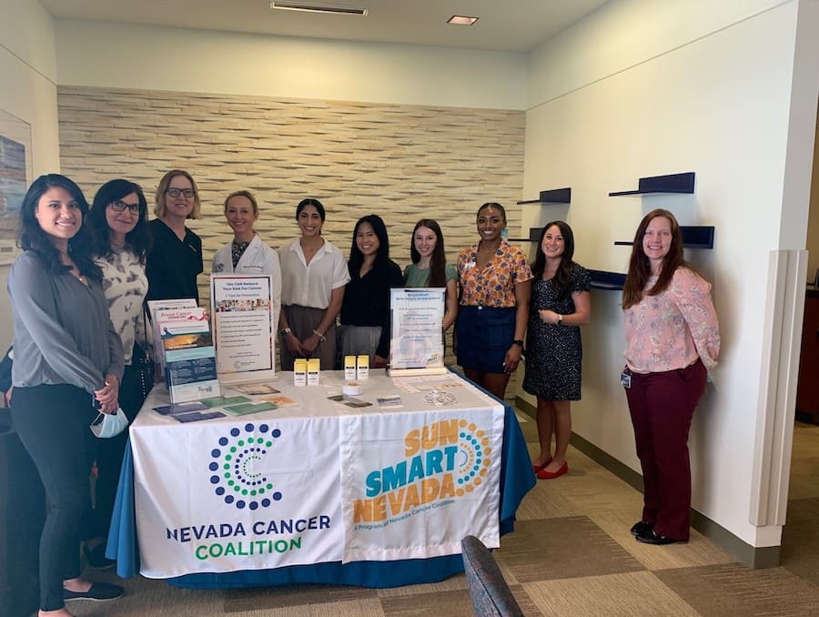 Lourdes Valdez and Ramneek Dhami posing for a photo with their volunteers at the free clinic.