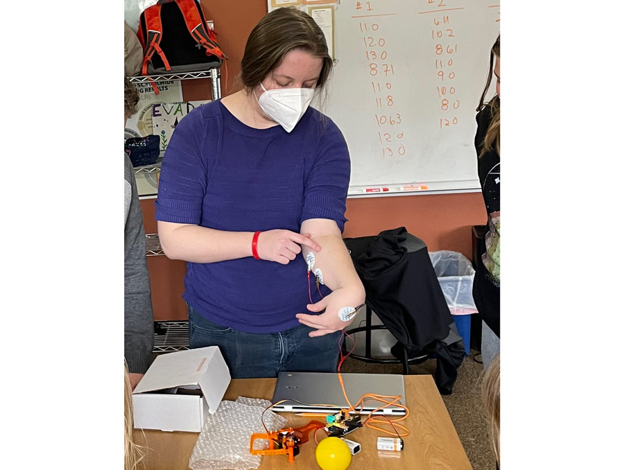 A University student demonstrates how nerves control movement.