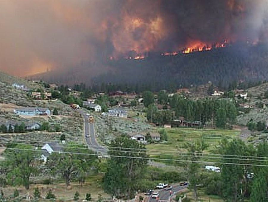 Waterfall Fire burning on a mountain with smoke in the air. 