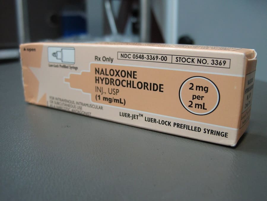 Box of naloxone on a table