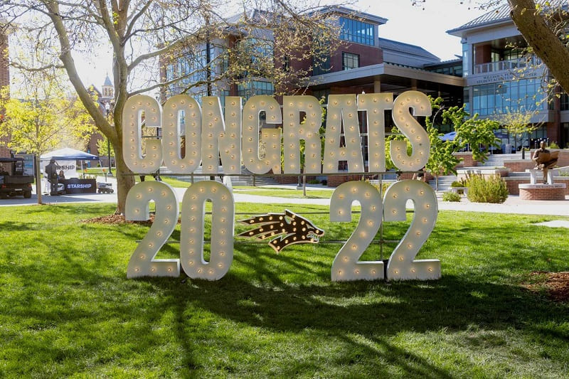 Giant letters with lights reading CONGRATS 2022 with a Wolf Pack logo