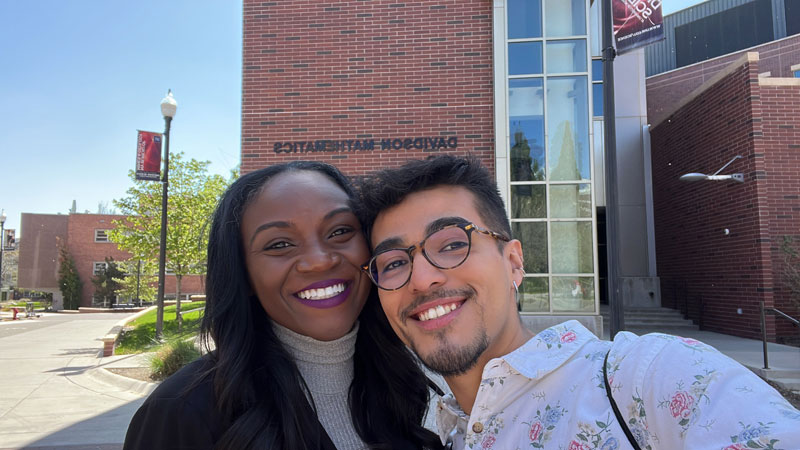 Kizzmekia Corbett takes a selfie with student Christopher Sanchez