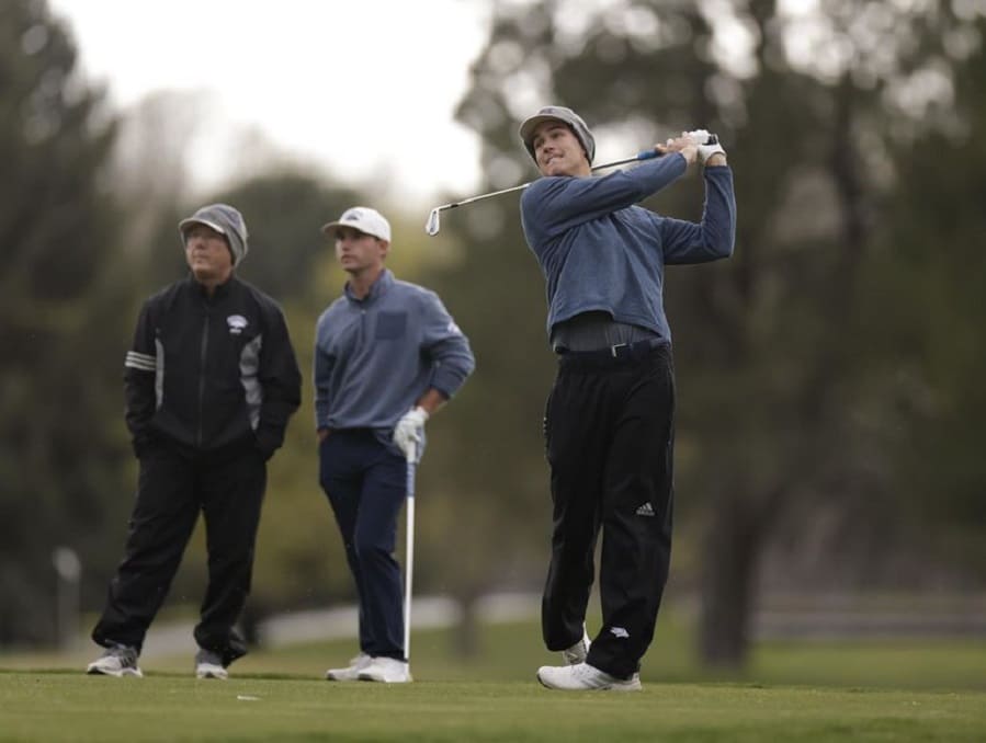 Trey Davis swings during a golf game