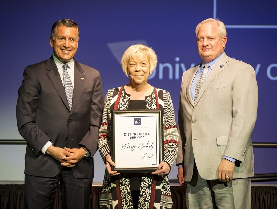 President Sandoval and Provost Thompson with Distinguished Service Award winner Mary Zabel